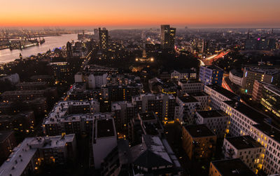 High angle view of illuminated city at dusk