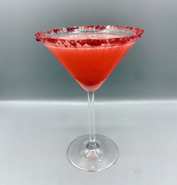 Close-up of beer glass on table against white background