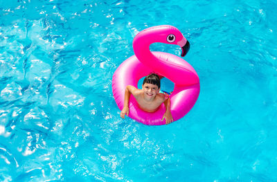 Close-up of red inflatable ring in swimming pool