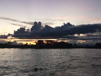 Scenic view of lake against sky during sunset