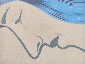 High angle view of text on sand at beach