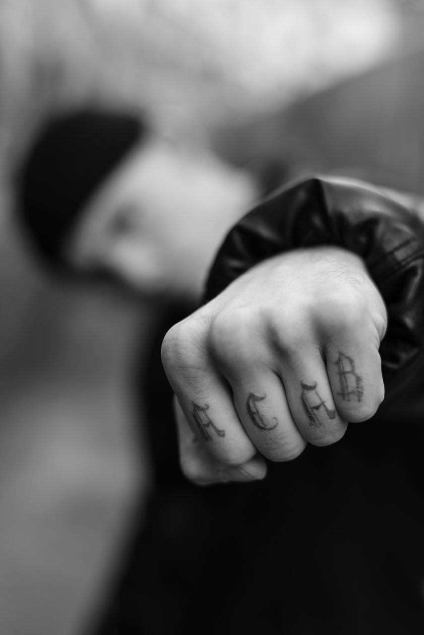 CLOSE-UP OF HUMAN HAND ON FINGER