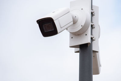 Two cctv cameras on a pillar of a modern building.video surveillance, security.