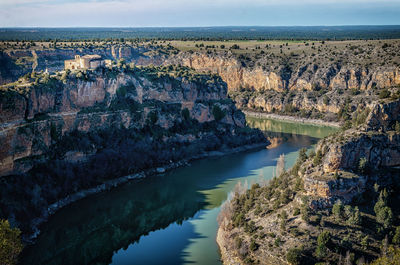 High angle shot of lake along rocky landscape