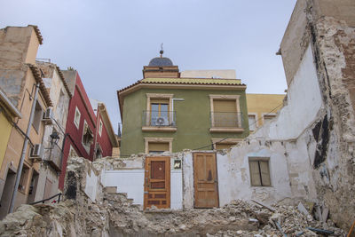 Demolished house in the center of a village.