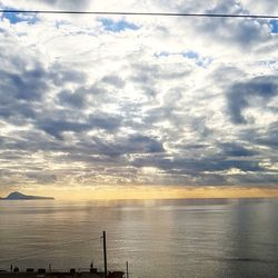 Scenic view of sea against sky at sunset