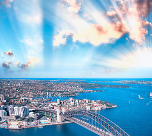 High angle view of sea and cityscape against sky