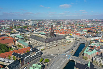 High angle view of street amidst buildings against sky