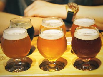 Close-up of beer glass on table