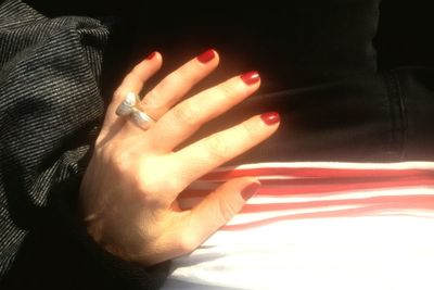 Close-up of woman hand with red hands