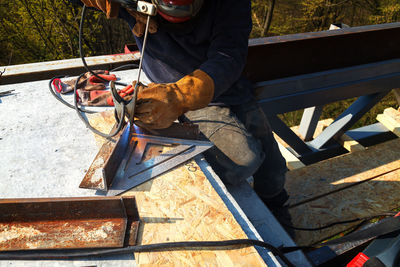 Low section of man working at construction site