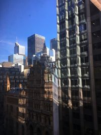 Low angle view of skyscrapers against sky