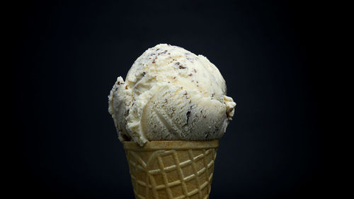 Close-up of ice cream against black background