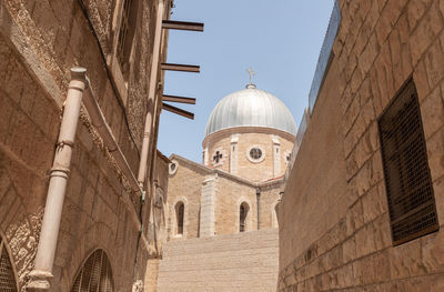 Low angle view of buildings against clear sky