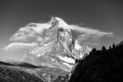 Low angle view of mountain at swiss alps against sky