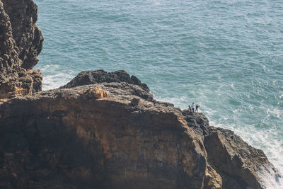High angle view of cliff against sea