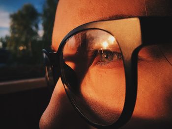 Close-up portrait of man wearing eyeglasses