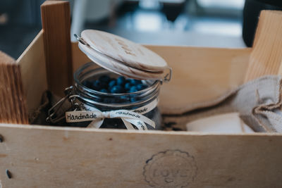 Close-up of wooden container on table