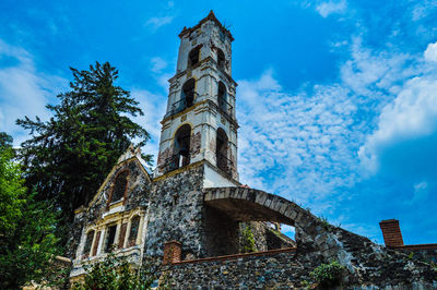 Low angle view of tower against blue sky