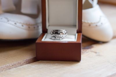 Close-up of wedding rings on table