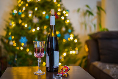 Close-up of wine bottles on table at home