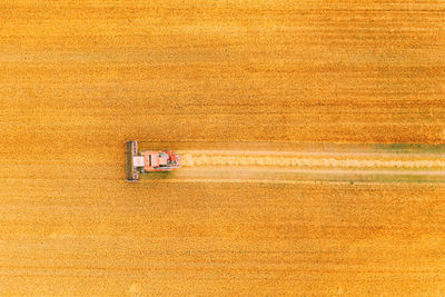 Aerial view of agricultural machinery working at farm