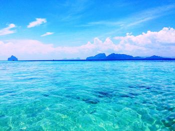 Scenic view of sea against blue sky