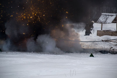 Snow covered landscape at night