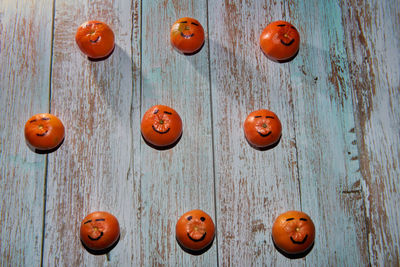 Close-up of pumpkin on wooden door