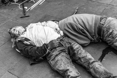 High angle view of men sleeping on street