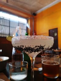 Close-up of beer glass on table