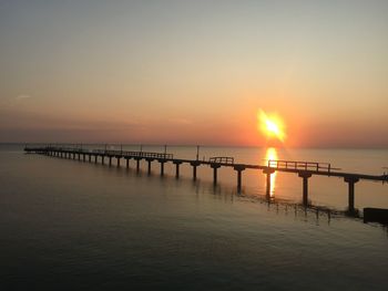 Scenic view of sea against clear sky during sunset