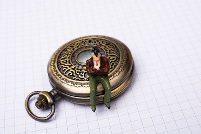 High angle view of clock on table