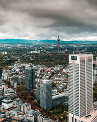 High angle view of modern buildings in city against sky