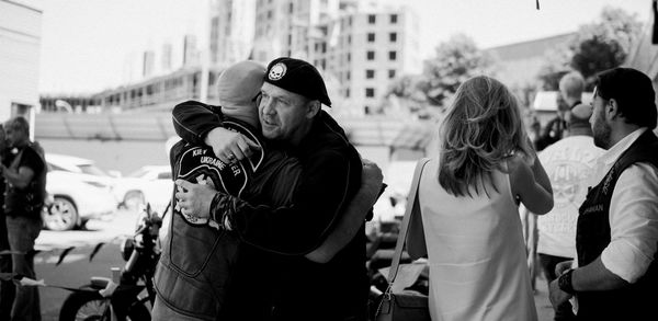 People photographing on street in city