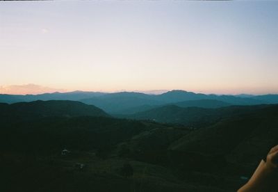 Scenic view of mountains against clear sky during sunset