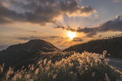 Scenic view of mountains against sky during sunset