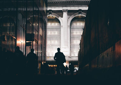 Rear view of men on corridor