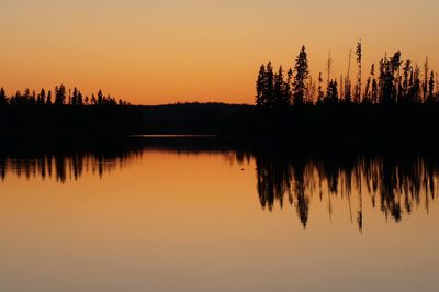 Scenic view of lake at sunset