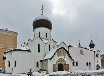 Building against sky during winter