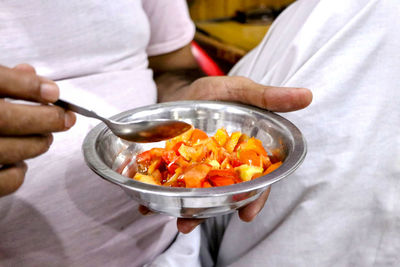 Midsection of man preparing food