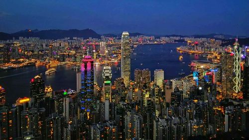 Aerial view of city lit up at night