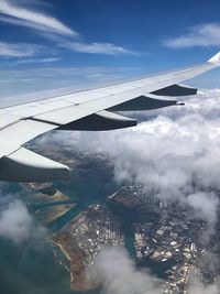 Aerial view of airplane flying in sky