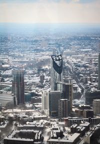 High angle view of modern buildings in city against sky