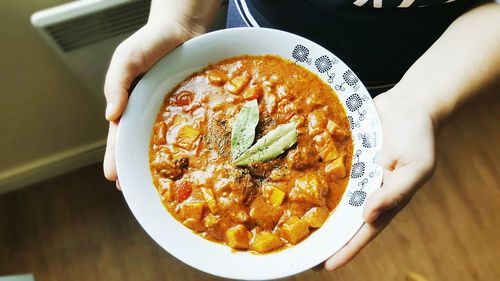 Close-up of hand in plate
