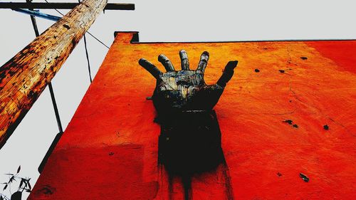 Low angle view of red wall