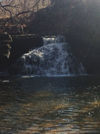 Water splashing in sea against sky