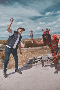 Representation of inca warrior dressed and with battle, prehispanic fighting with a tourist in peru