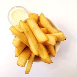 Close-up of burger on plate against white background