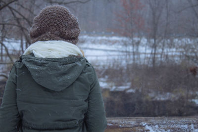 Rear view of woman in snow